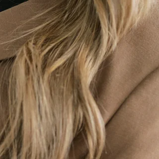 Close-up of dimensional blonde highlights in a Salon Joy client's hair
